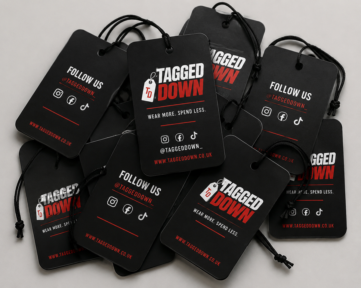 Black tags with 'Tagged Down' branding on a gray background