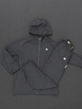 Authentic Boys Montirex black tracksuit, brand new with tags, including a hooded jacket and matching trousers.