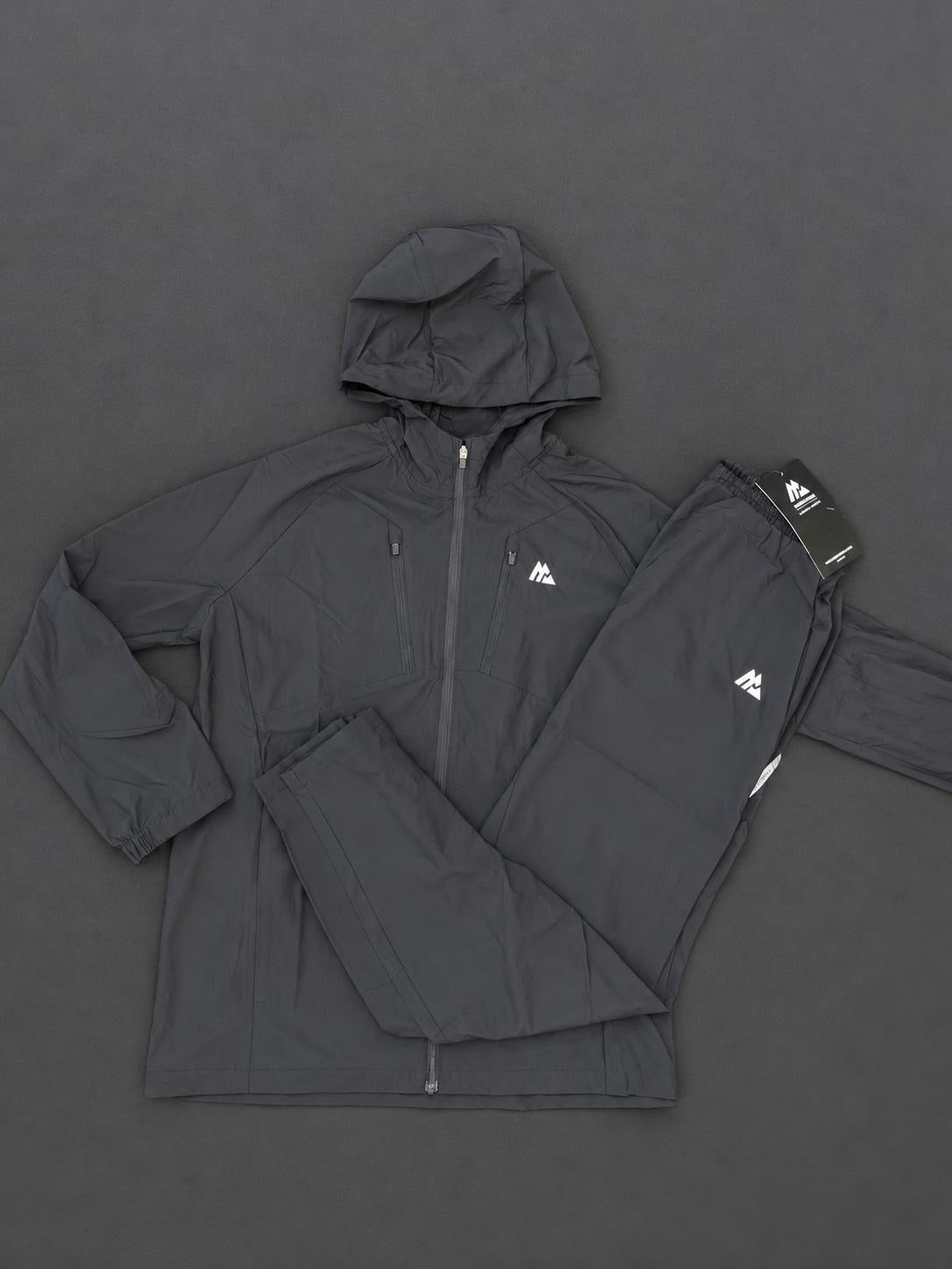 Authentic Boys Montirex black tracksuit, brand new with tags, including a hooded jacket and matching trousers.