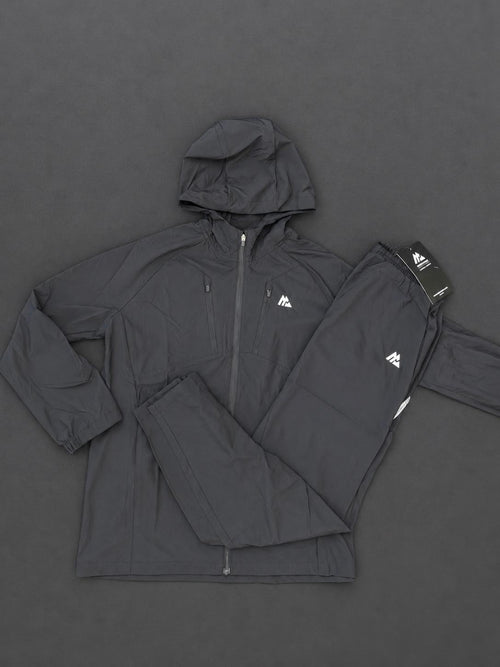 Authentic Boys Montirex black tracksuit, brand new with tags, including a hooded jacket and matching trousers.