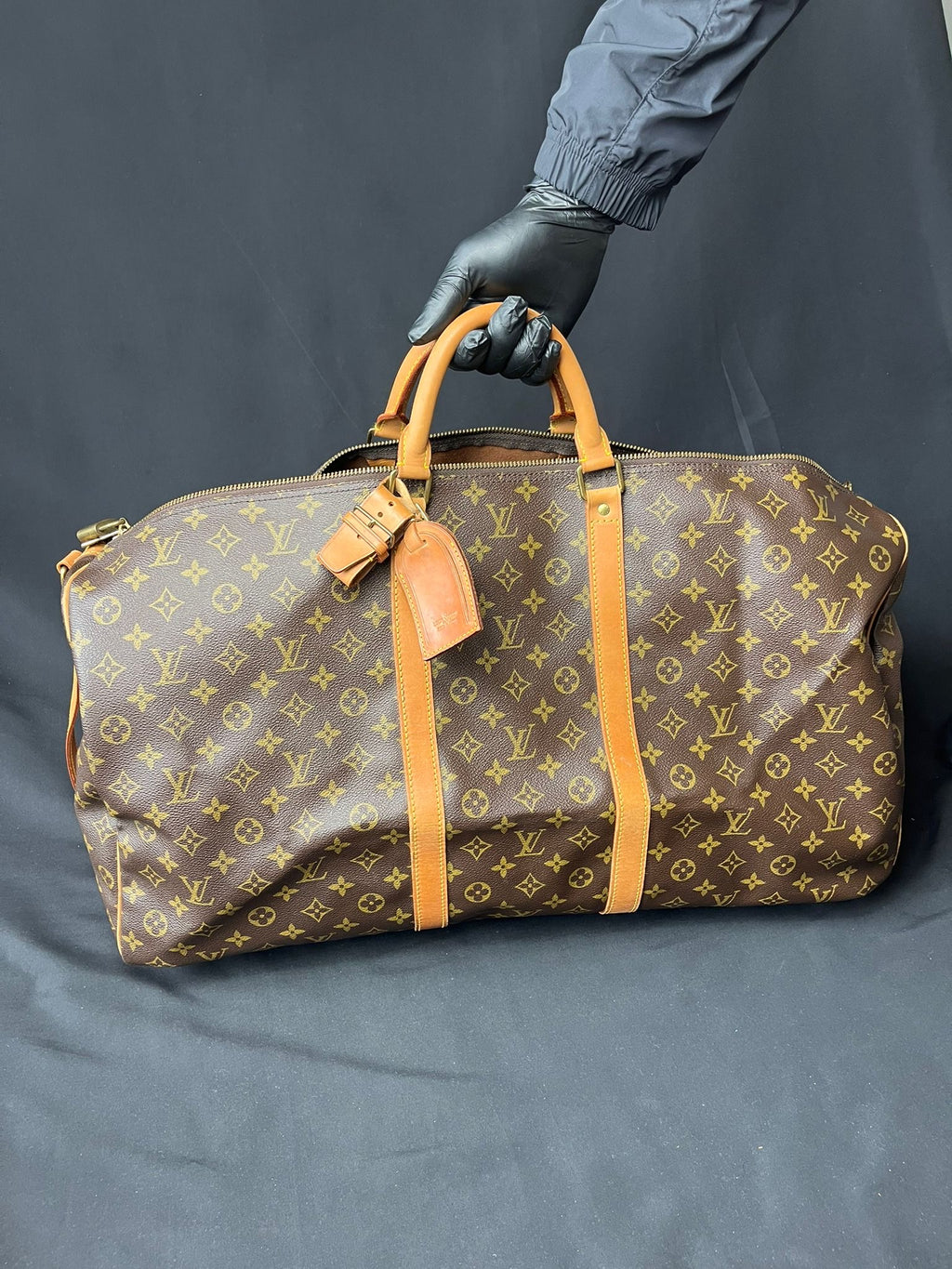 Authentic Louis Vuitton Keepall 60 Monogram travel bag, pre-owned in excellent condition with age-related marks.