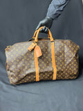 Authentic Louis Vuitton Keepall 60 Monogram travel bag, pre-owned in excellent condition with age-related marks.