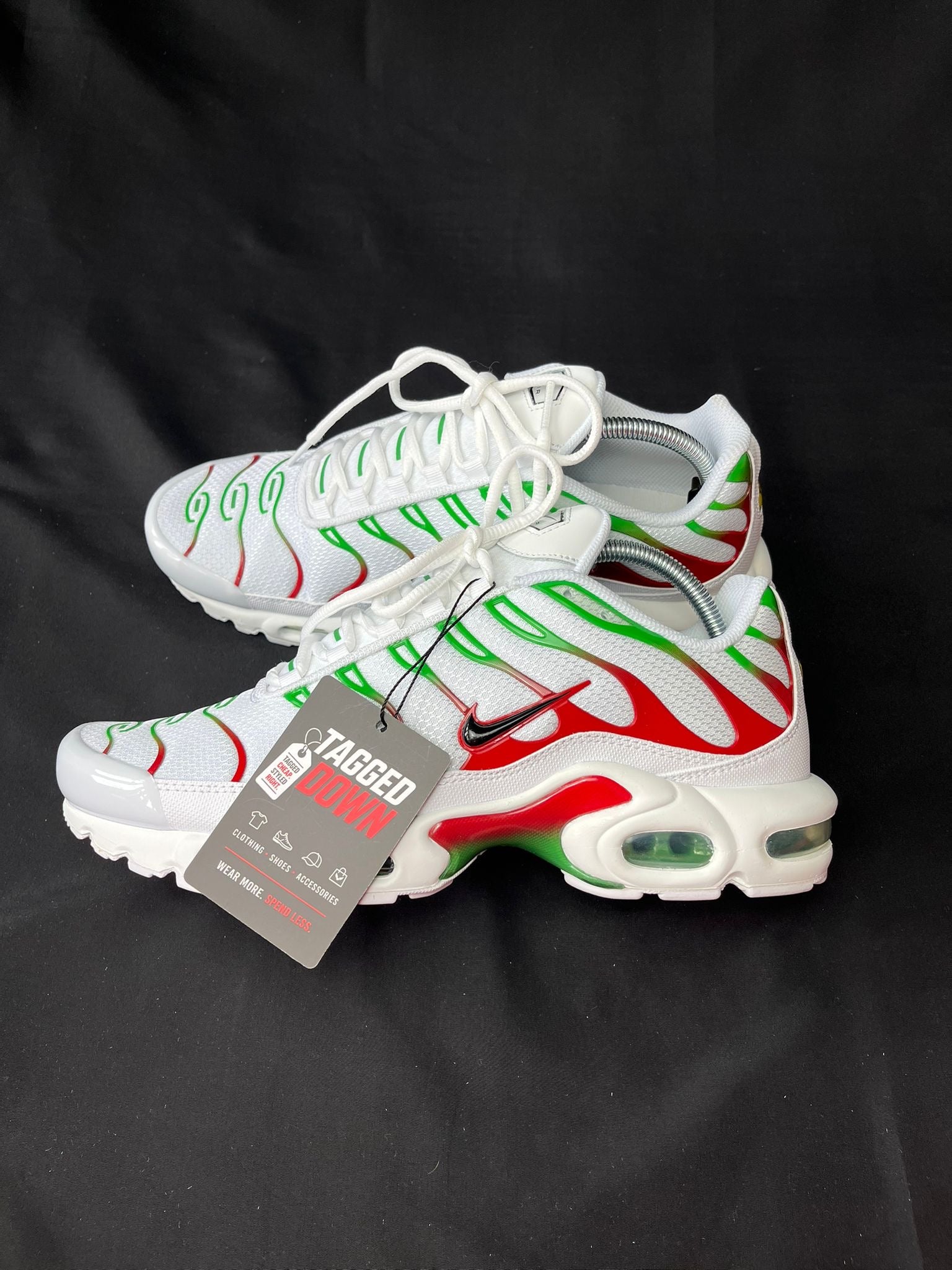Nike Air Max Plus TN trainers in white with green and red detailing, brand new in the box.