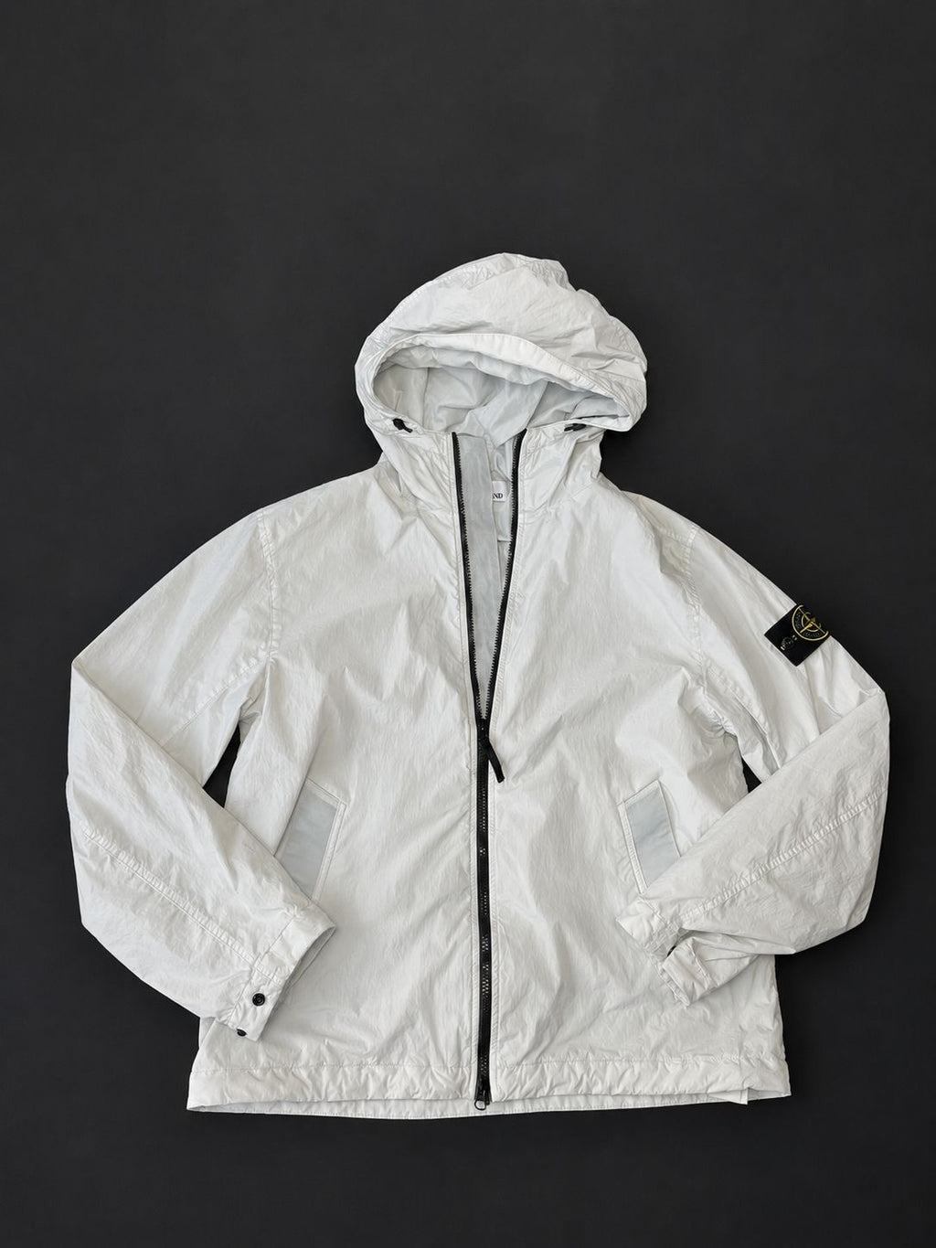 Stone Island Ice Blue hooded jacket with full zip fastening and Compass sleeve badge, pre-owned in excellent condition.