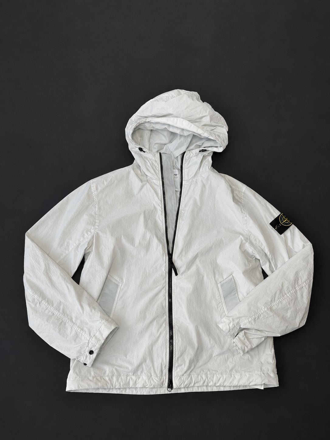 Stone Island Ice Blue hooded jacket with full zip fastening and Compass sleeve badge, pre-owned in excellent condition.