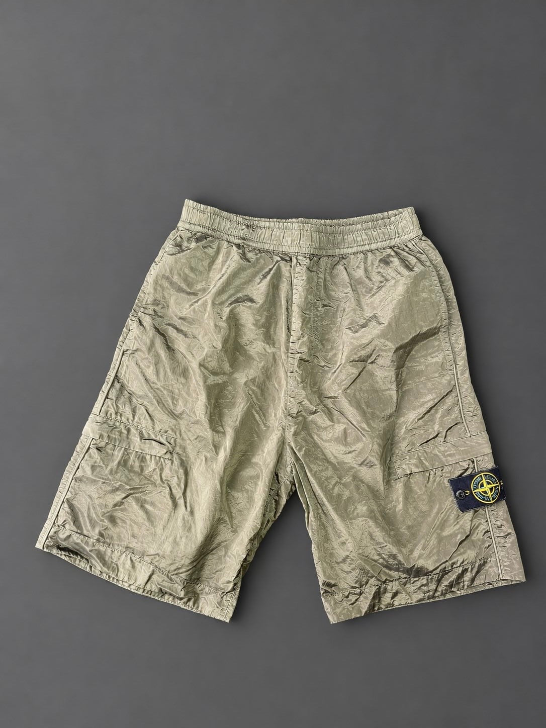 Authentic Stone Island Nylon Metal Khaki cargo shorts with removable Compass badge, pre-owned in excellent condition.