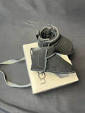 UGG Baby Boots in Black. Brand new with the original box and soft sheepskin lining.